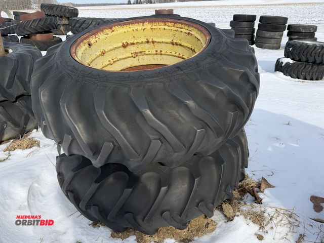 Lot 1-11620 - (1) set of used clamp on duals, size 18.4-34, tires are weather checked and dry rotted.