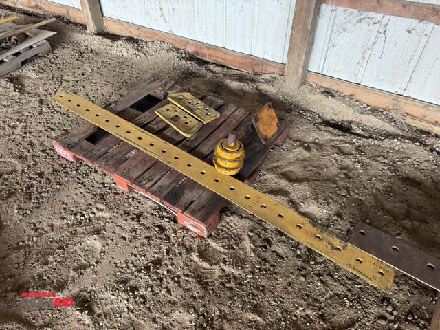 Lot 1-18307 - (1) 8' cutting edge for a John Deere 1150C dozer, hitch, and other parts.