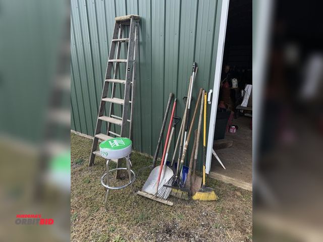 Lot 1-19933 - Lot of assorted hand tools, includes (1) log turner, concrete come-along, shovels, rakes, brooms, (1...