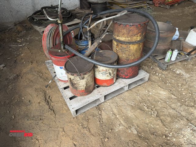 Lot 1-18279 - (1) skid of assorted grease buckets, includes manual pumps, (1) pneumatic, and (1) retractable greas...