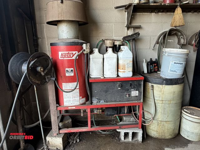 Lot 1-18550 - (1) Hotsy natural gas steam cleaner, 220V, includes assorted soaps, approx. 50' hose with gun and re...