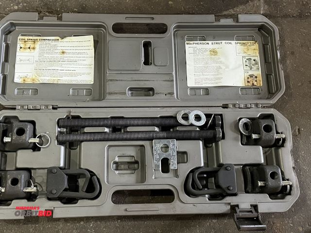 Lot 1-1145 - (1) kit with coil spring compressor and MacPherson Strut coil spring tool, unknown if unit is comple...