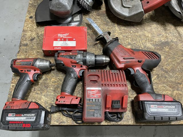 Lot 1-19353 - Lot of Milwaukee 18V cordless power tools, includes impact, 1/2" hammer drill, Sawzall, (1) high out...