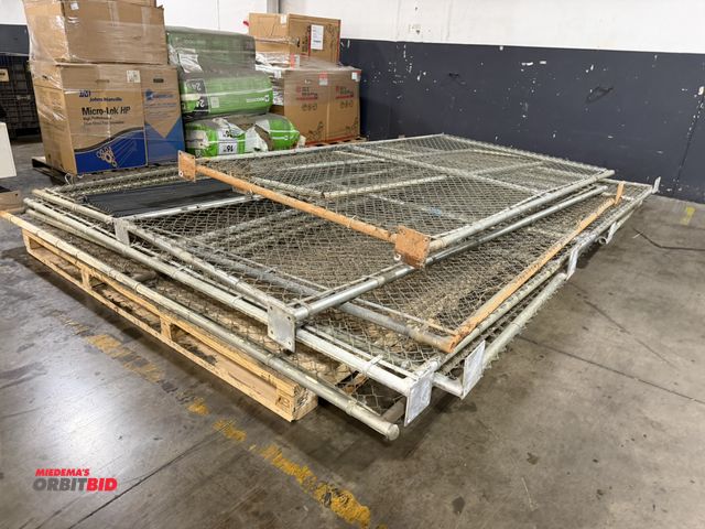 Lot 1-5615 - (1) skid of assorted sections of chain-link fence with frame and bolt mounts on bottoms of each sect...