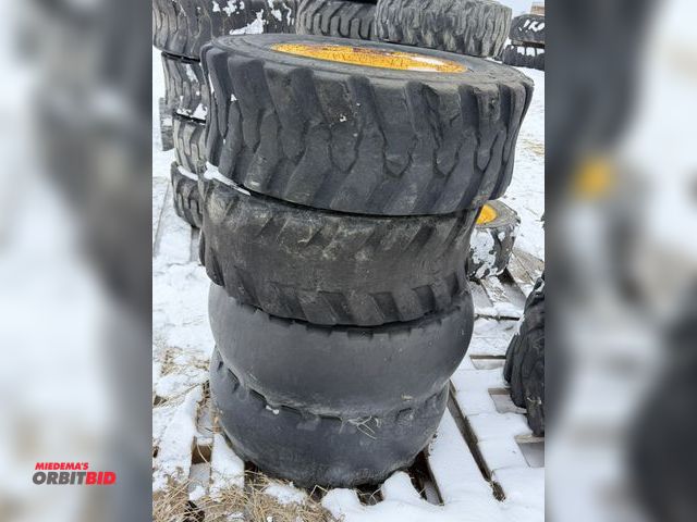 Lot 1-11683 - Lot of (4) 10-16.5 skid steer tires on 8-bolt heavy duty rims, 1 rim has rounded out bolt holes, tir...