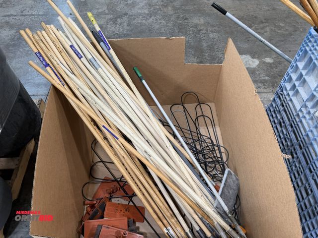 Lot 1-5450 - Large lot of assorted wood broom handles with approx. (12) 3M Doodle Bug pad holders.