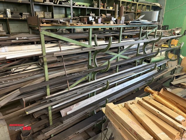 Lot 1-18578 - (1) approx. 10' long x 64" tall x 42" deep steel storage rack with assorted steel flat stock, round ...