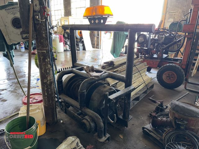 Lot 1-1302 - (1) 40-ton capacity mechanical winch mounted to a 52" width x 56" height x 22" depth steel rack, inc...