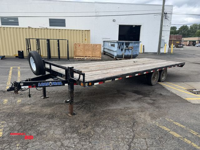 Lot 1-16675 - 2015 Load Trail Tandem axle Equipment Trailer 2" thick wood decking by 24 foot bed length, 2 5/16" b...