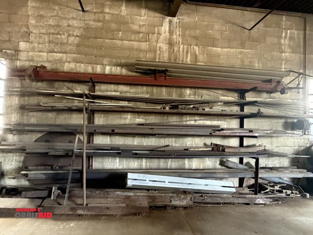 Lot 1-18101 - (1) 12' length x 8' height steel cantilever rack with contents of assorted flat stock, rectangular b...