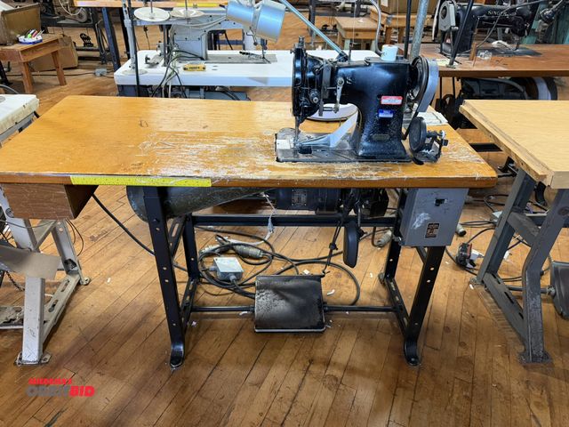 Lot 1-4679 - (1) Singer, model 108W7, commercial sewing machine on Singer power table, 3 phase, 1/2 HP motor, spo...
