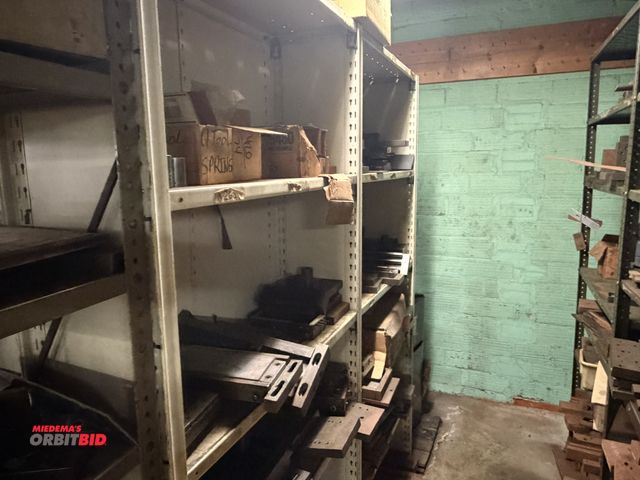 Lot 1-18597 - (1) 73.5" width x 84" height x 12" depth steel shelving unit with contents of various stamping block...