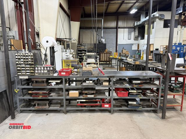 Lot 1-18699 - Contents of table, includes assorted dial face dies for Howard Miller clocks, and (2) sliding parts ...