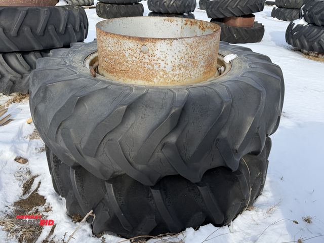 Lot 1-11622 - (1) set of used 18.4-34 clamp on duals, tires are dry rotted, and weather checked.