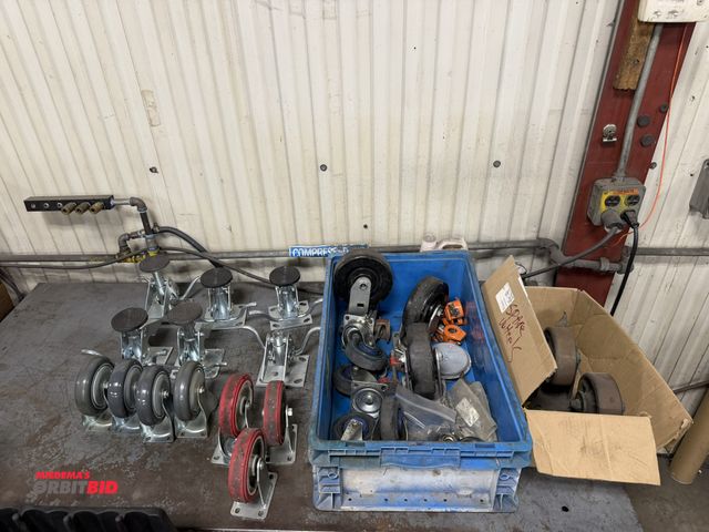 Lot 1-15319 - Large lot of assorted steel caster wheels, some on swiveling bases, includes (2) 6" diameter, (3) 5"...