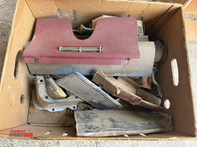Lot 1-8557 - Lot of assorted vintage GM car parts, includes dash covers, trim pieces, crank case air filters, sta...
