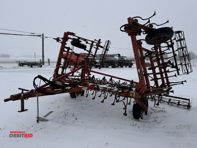 Lot 1-10418 - (1) Case 365 cultivator, approx. 24' wide with hydraulic fold down wings, rear rolling baskets, S/N ...