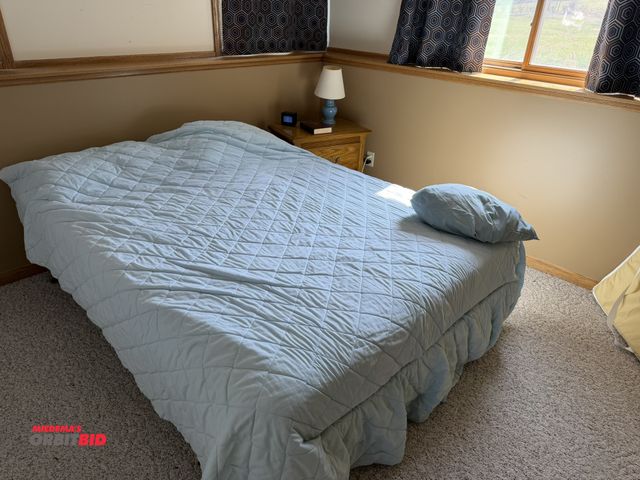 Lot 1-19217 - (1) full size bed with steel frame, and 2-drawer night stand, small lamp, and clock.