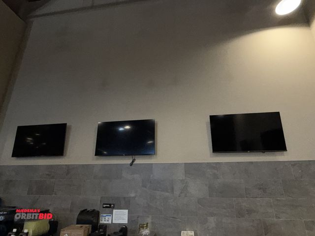 Lot 1-11303 - Lot of (2) Hisense 55" HDMI flatscreen TV's with wall mounts, and (1) Samsung 55" flatscreen with wa...