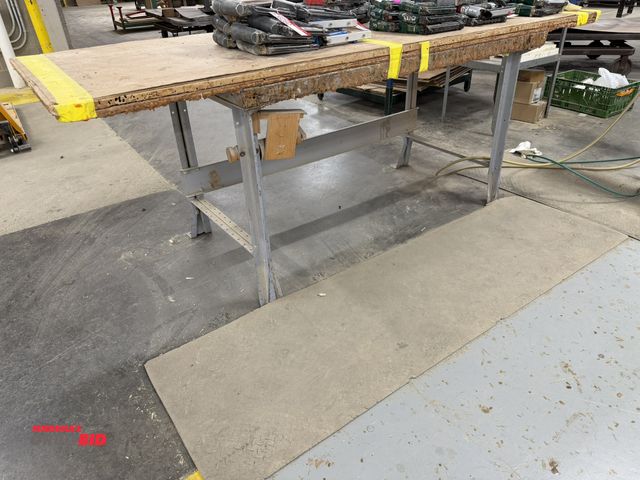 Lot 1-16281 - (1) 58" width x 35" height x 34" depth work bench with an added wood top, contents not included.
