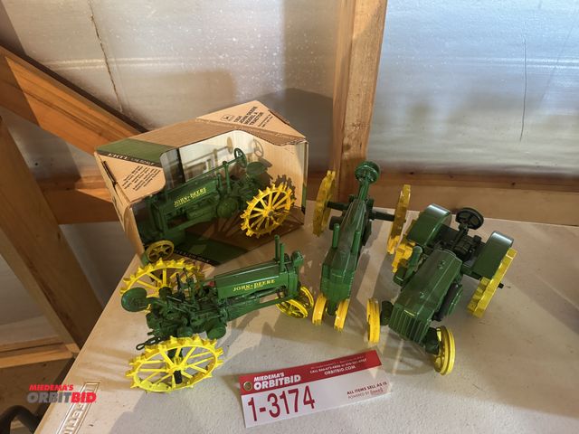 Lot 1-3174 - (4) John Deere Die Cast Tractors, including; (1) model D, (1) model G, and (2) General Purpose tract...
