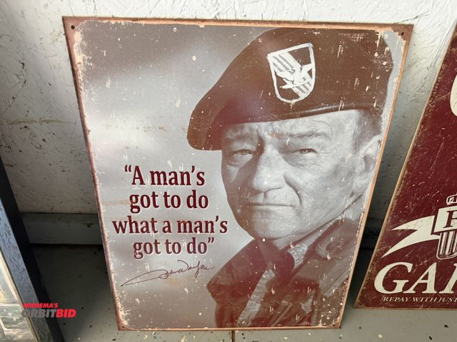 Lot 1-8165 - (1) 12" x 16" collectible reproduction tin John Wayne sign.
