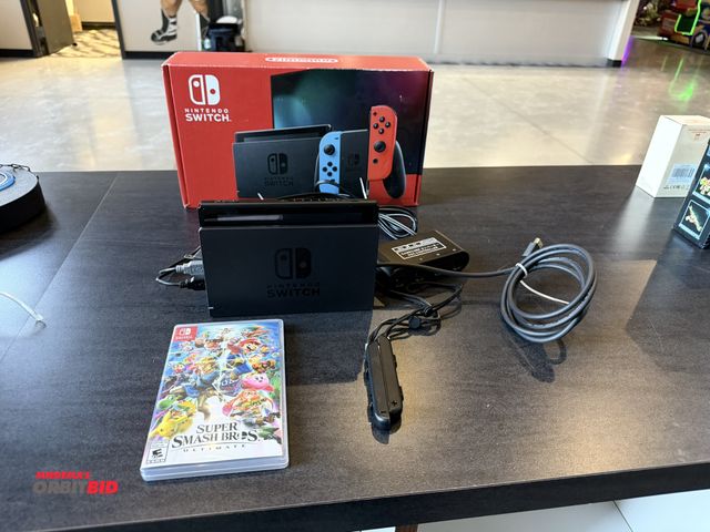 Lot 1-11284 - (1) Nintendo switch, model HAC-001/01, includes docking station, charging cords, tethers, (1) Super ...