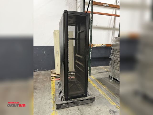 Lot 1-5591 - (1) APC 24" width x 80.5" height x 41" depth steel server storage rack with perforated door.