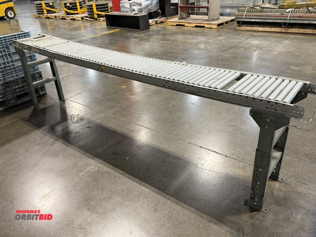 Lot 1-5409 - (1) 12" width x approx. 10' length roller conveyor section with adjustable height legs.