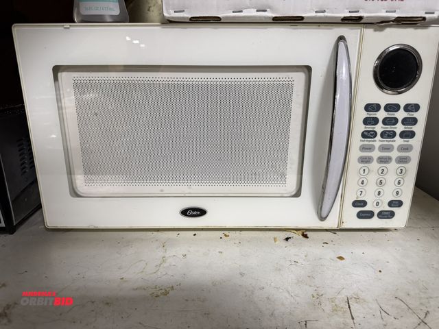 Lot 1-12560 - (1) Oster microwave oven with push button and pre-set controls, carousel table, in working condition...