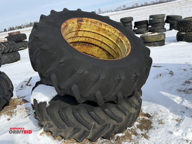Lot 1-11619 - (1) set of used Firestone 18.4-34 clamp on duals, tires are weather checked, 1 tire has slice in sid...