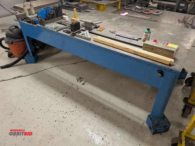 Lot 1-6620 - Large heavy duty steel shop table, includes cut-threw ridge in middle of table, includes large assor...