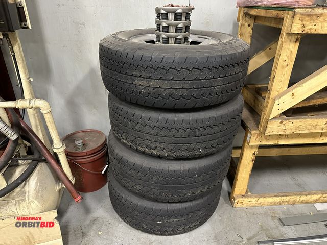 Lot 1-19156 - Set of (4) Bridgestone Dueler A/T, size P265/70R17 tires with 6-bolt rims, and center caps (previous...