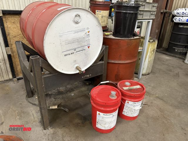 Lot 1-15385 - (1) partial 55 gallon drum of Citgo Hydurance AW fluid, includes barrel stand, and (2) partial 5 gal...
