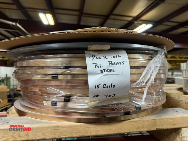 Lot 1-18693 - Lot of (12) 15/32" x .016" polished brass, and (1) coil of polished steel.