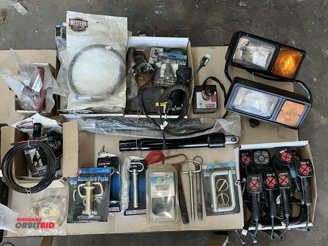 Lot 1-14163 - Large lot of assorted plow related items, includes Halogen headlights, Western remotes, various clev...