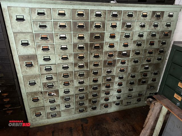 Lot 1-4710 - (1) 114-drawer wooden parts cabinet filled with assorted screws, nuts, bolts, washers, fuses, machin...