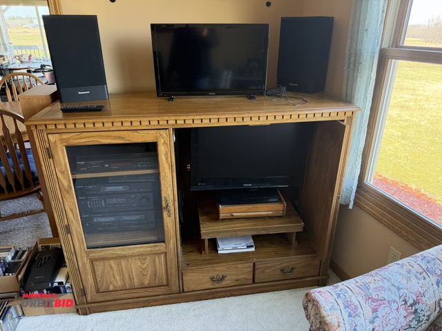 Lot 1-19182 - (1) entertainment center, approx. 58" wide, with Toshiba 26" HDMI TV, and Insignia 24" TV, and Panas...