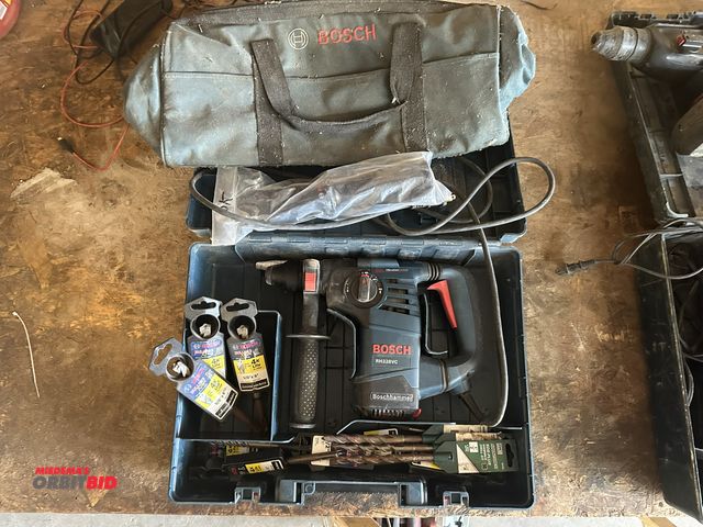 Lot 1-14180 - (1) Bosch, model RH328VC, electric hammer drill with case, various new drill bits, and a Bosch canva...
