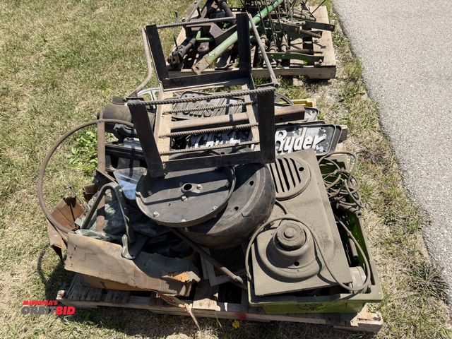 Lot 1-18070 - Skid lot of assorted items, includes Chisholm-Ryder signs, planter closing wheels, electric motors, ...