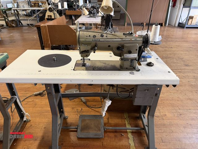 Lot 1-4689 - (1) Singer 457 commercial sewing machine on power table, 1/2 HP, 4-pole, 3 phase electric motor, spo...