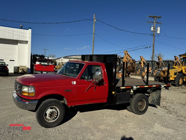 Lot 1-18261 - 1997 Ford Stake Truck F Super Duty manual 4-speed transmission with overdrive, manual windows and lo...