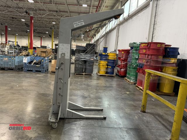 Lot 1-5444 - (1) Muller Martini, 770 lb. max capacity crane/hoist, includes (2) 42" long steel lift attachments.