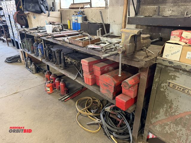 Lot 1-18530 - (1) wood work bench, 114" long x approx. 30" deep x 33" tall, includes 5" Wilton bench vise, and man...