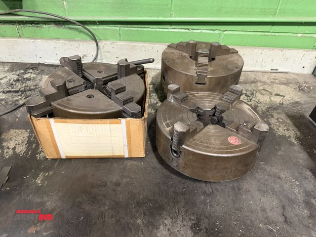 Lot 1-18588 - Lot of (3) chuck jaws, includes Enco 10" 4-jaw chuck, Chinyu 10" 4-jaw chuck, and 10" 3-jaw chuck.