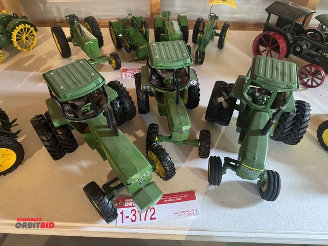 Lot 1-3172 - (3) John Deere Die Cast Tractors, inclduing; (1) model 4850, (1) model 2550, and (1) unknown model