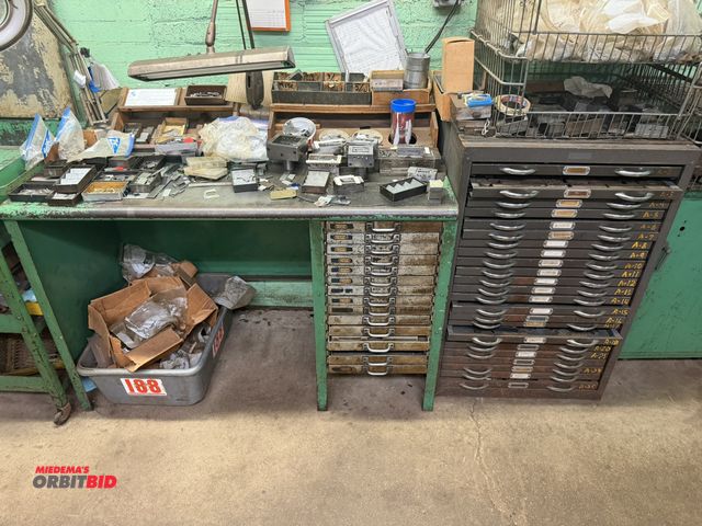Lot 1-18616 - Lot including (1) 52" width x 34" height x 25" depth steel work bench with 15 drawers filled with as...