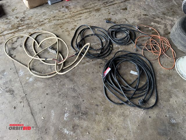 Lot 1-19903 - Lot of (4) assorted 220V plugs, approx. 25' to 50' in length.