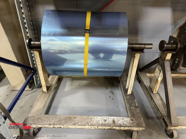 Lot 1-18702 - (1) 24" wide partial roll of aluminum, .032" thickness, 342 lb. of net weight, includes roller stand...