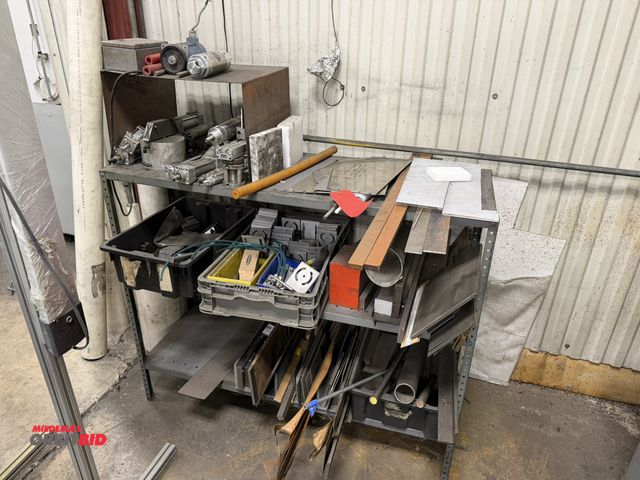 Lot 1-15348 - (1) rack with assorted cut metal scrap pieces, air cylinders, and more, includes metal shelving unit...